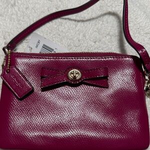 Coach Women's Magenta Wristlet with Bow Detail